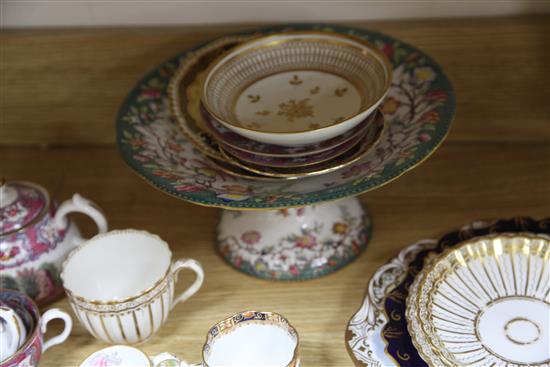 A collection of 19th century floral painted teaware and a French gilt decorated two handled vase